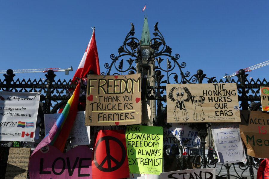 The front gate of Parliament of Canada is covered with banners, as demonstrators
continue to protest the vaccine mandates implemented by Prime Minister Justin
Trudeau on February 7, 2022 in Ottawa, Canada. – Canadian authorities struggled
Monday to tackle a truckers’ protest against Covid restrictions which has
paralyzed the national capital for days and threatens to snowball into a
full-blown political crisis for Prime Minister Justin Trudeau. (Photo by Dave
Chan / AFP)