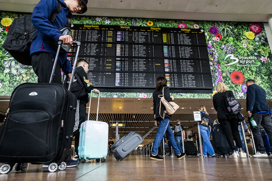 Illustration picture shows people with luggages passing by the departures
flights board in the hall in marge of a press meeting of Brussels Airport to
present the 2022 results and the financial results, Wednesday 24 May 2023 in
Zaventem. BELGA PHOTO HATIM KAGHAT